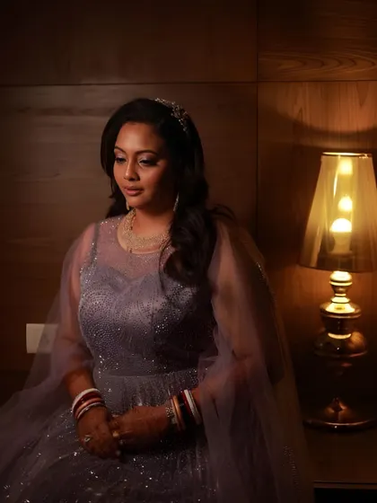 Another beautiful shot highlighting her bridal glam. The makeup is soft yet defined, ensuring she looks flawless from every angle.