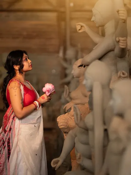 Another artistic shot from the Durga Puja series. The makeup is designed to look serene and beautiful, capturing the essence of the festival.