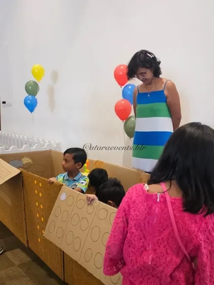 Simple, imaginative play is always a hit. Here, kids enjoy playing in a large cardboard box, proving that fun doesn't always need to be complicated.