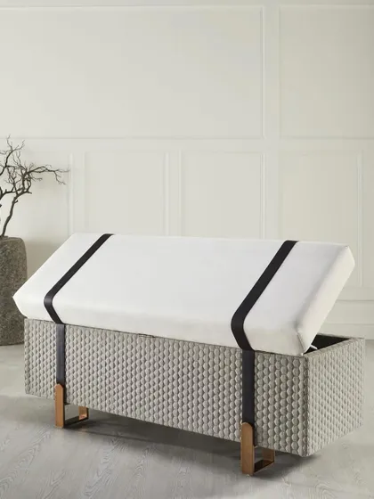 The same bench, shown with its storage lid open. This shot effectively communicates the dual function of the piece as both stylish seating and a practical storage solution.