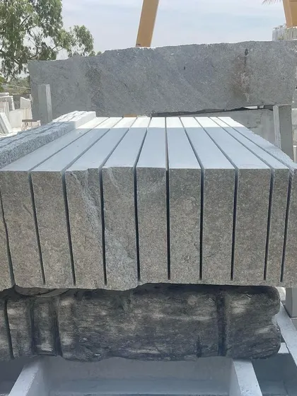 A large block of granite after being cut into multiple slabs by the gang saw.