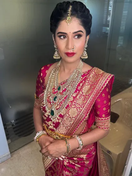Royalty at first glance. This look for a bangle ceremony features a rich pink Sabyasachi saree and dramatic eye makeup.