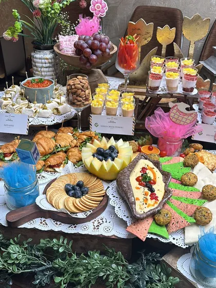 This view highlights the variety on our baby shower grazing table, from mini croissants and dessert shots to fresh fruit displays and cheese boards, ensuring there's a treat for every guest.