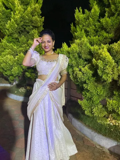 A wink and a smile in our beautiful off-white lehenga.