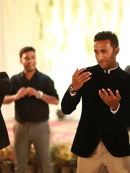 The 'Team Groom' in action, showing off their moves and having a great time on stage.