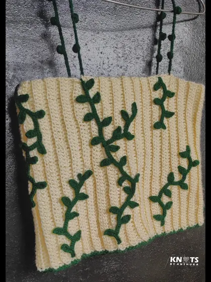 My ivy crochet top, inspired by nature. I hand-stitched the green vine details onto the cream-colored ribbed top.