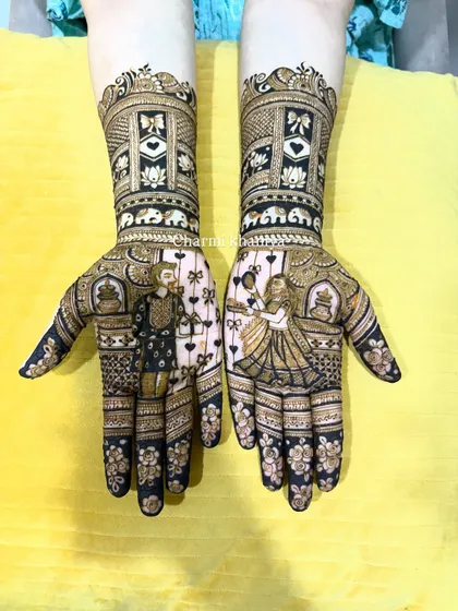 A full view of the Teej mehendi with couple portraits.