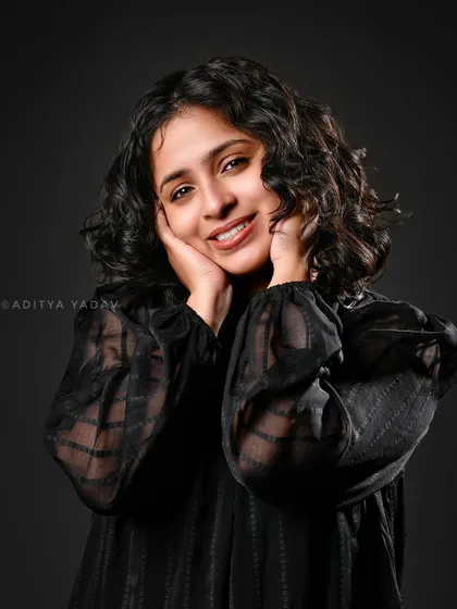 A professional studio portrait created for a beauty brand. This image demonstrates my control over studio lighting to create a soft yet defined look, highlighting the model's natural curls and warm expression. This is ideal for branding, headshots, or commercial photography.
