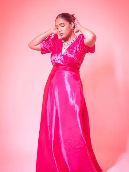 Anupama Gowda looking like a real-life Barbie in this vibrant pink gown with puff sleeves.