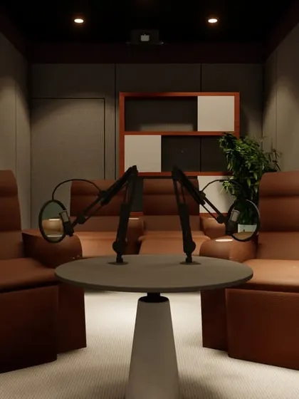 This angle shows the complete two-person podcast setup, with a central table and professional microphones, all within a beautifully designed and acoustically controlled room.