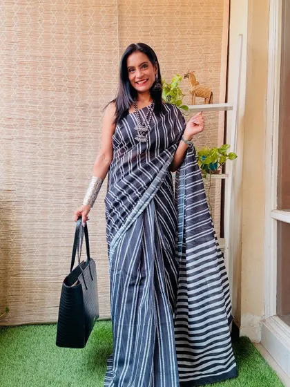 This black and white striped ready-to-wear saree is a chic and modern option for the office. It's professional, stylish, and saves you time in the morning.