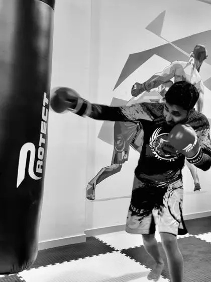 A student working on his straight right hand on the heavy bag. Generating power comes from the ground up, using your whole body, not just your arm.