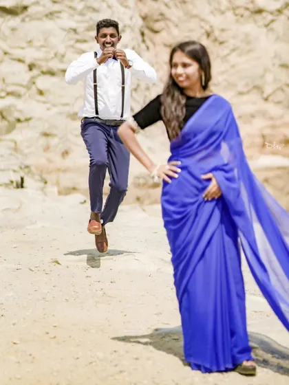A playful and candid shot with the groom jumping in the background. It shows the fun and spontaneous moments I love to capture.