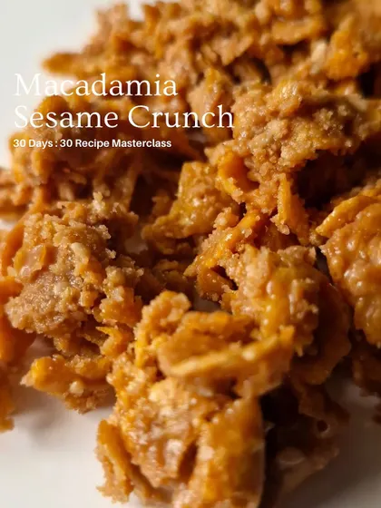 Macadamia Sesame Crunch, a gourmet texture element with a sophisticated flavor profile.