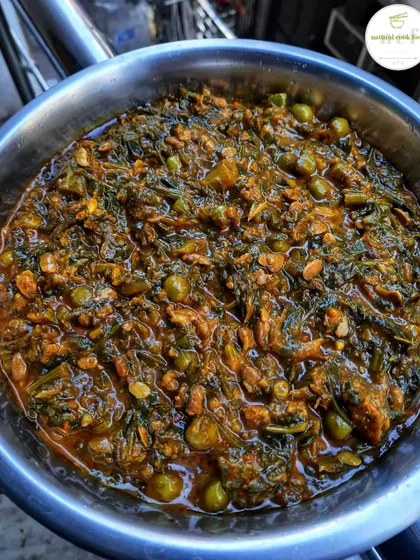 A bowl of indigenous Chagempomba, a unique and traditional Manipuri vegetarian curry made with fermented soybeans and vegetables.