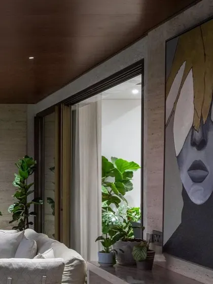 Another view of the large portrait, showing how it commands the space and works beautifully with the modern, luxurious decor of the home.