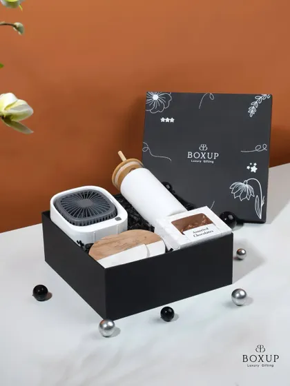 Beat the summer heat with our Cool Down hamper. This simple yet effective Women's Day gift includes a mini desk fan and a sipper bottle to help you keep calm and cool.