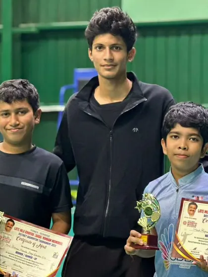 Rishaan and Rupansh with their coach and trophies. This shows our commitment to developing talent in the younger age groups for doubles events.