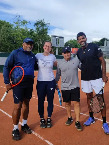 Posing with my team on the practice courts in Paris. Tennis is an individual sport, but it takes a strong team to succeed.