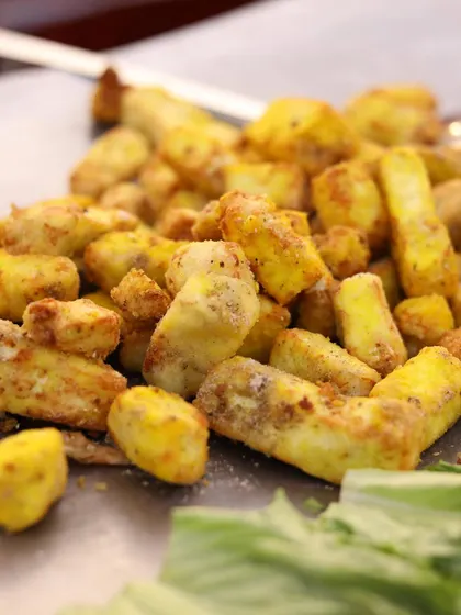 A close-up of perfectly grilled and seasoned paneer tikka, fresh off the tawa at one of my live cooking stations. I focus on using quality ingredients to deliver incredible flavor in every bite.