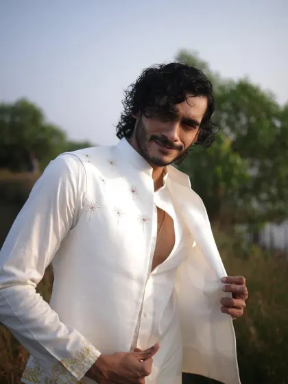 A close-up of Vishak Nair, showing the texture and fit of the custom jacket. My focus for male celebrities is often on sharp tailoring and unique details that stand out.