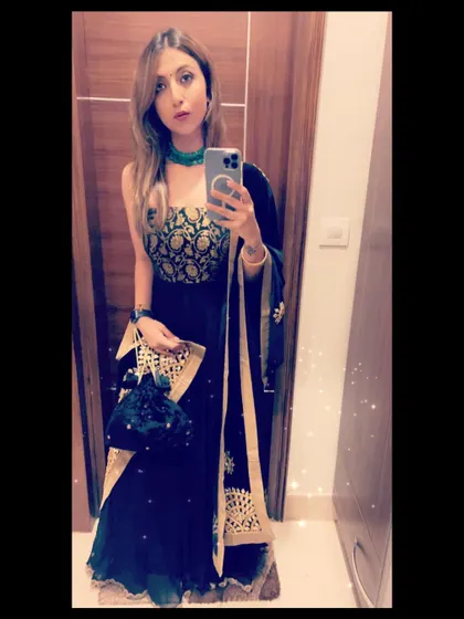 A festive mirror selfie in a dark blue anarkali with a beautiful gold embroidered bodice.