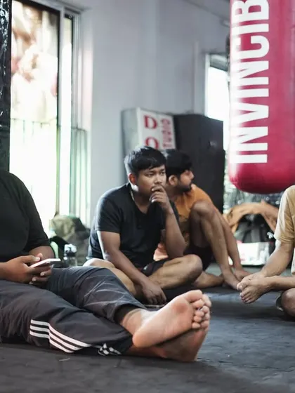 A quiet moment of observation during a training session. Coaching is about seeing the potential in a fighter and guiding them to unlock it. This is the most rewarding part of my job.