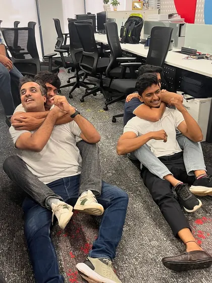 Participants practicing ground-based chokehold escapes. It's not just about standing techniques; we cover various situations.