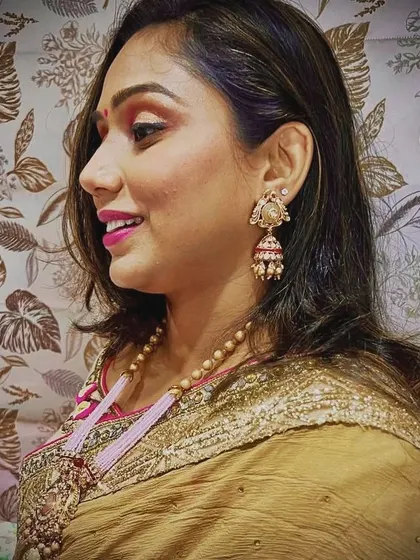 A profile shot of my client wearing the long pink necklace set. The matching jhumkas complete the look beautifully.