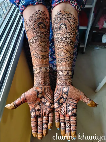 A gorgeous bridal mehendi with no figures. This design uses peacocks, lotuses, and intricate patterns to create a full and beautiful look.
