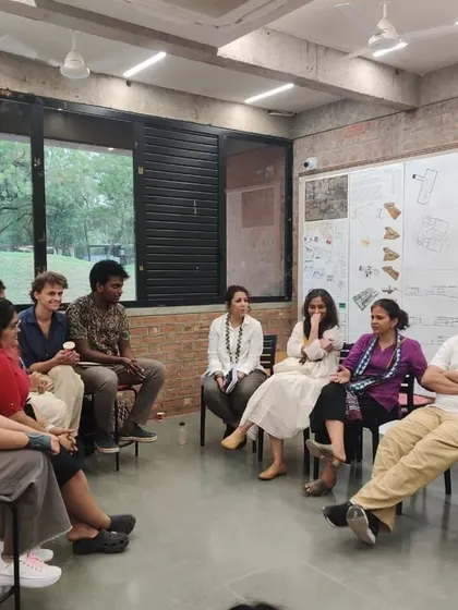An informal discussion with students and faculty after the jury session. These conversations outside the formal review are often where the most meaningful exchanges happen.