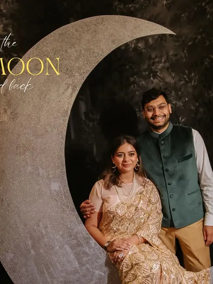 "To the moon and back." A romantic photo booth we designed for a retro-themed reception, allowing the couple and guests to capture magical, celestial-inspired photos.