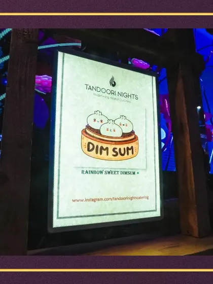 A custom menu sign for our Dim Sum station. We often create fun and artistic signage to match the theme of our food stations and the overall event.