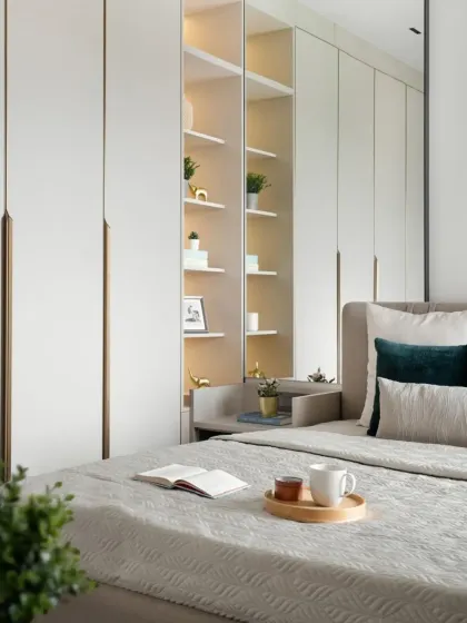 My work is about creating furniture that fits your life. This bedroom shows a fully integrated wall unit, combining a seamless wardrobe with a built-in bedside shelf and display niche, keeping the room feeling open and serene.