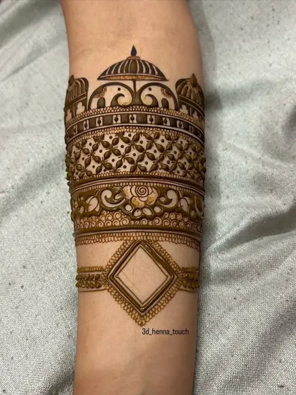 The arm band design with the outline for a geometric pattern at the bottom. This shows how we plan our designs to ensure they are balanced and symmetrical.