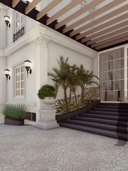The entrance to one of the residences within "The Clarence," featuring a grand staircase and a pergola-covered walkway. This space provides a seamless transition from the shared driveway to the private home.