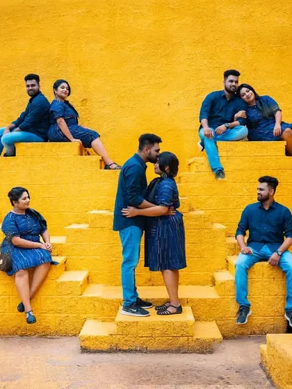 A creative composite pre-wedding photo showing a couple in various poses against a vibrant yellow stepwell, telling a story in a single frame.