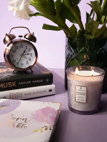 Our Bulgarian Lavender two-wick candle, presented in an engraved, hand-cut glass vessel. This candle is designed to be a sophisticated decor piece, offering a calming scent and a touch of elegance.