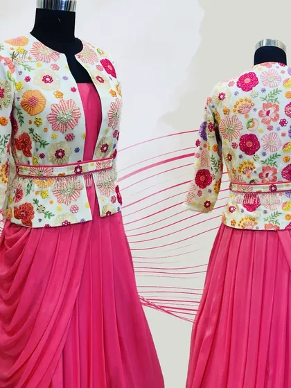 A beautiful pink draped gown paired with a colorful, fully embroidered floral jacket and matching belt.
