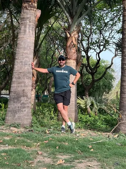 A member enjoying a moment of peace in nature after a group run. Our runs are a great way to connect with both people and the outdoors.