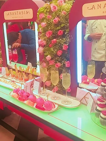 A vibrant and stylish dessert and beverage bar we designed for a corporate event with Anastasia Beverly Hills. We create themed setups that integrate seamlessly with your brand's aesthetic, featuring custom treats like lip-themed cupcakes and colorful mocktails.