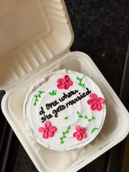 A perfect cake for a "Friends" fan who is getting married! This pretty floral bento cake has the message "d one where she gets married," a sweet nod to the show's episode titles.