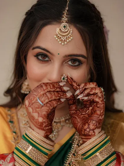 Nothing makes me happier than seeing a glowing bride. Here is a beautiful client showing off her engagement mehendi, with the rich color complementing her stunning traditional jewelry and attire.
