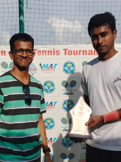 Open Singles Champion Sricharan receiving his trophy. Our open tournaments attract a strong field of players, making for exciting and high-quality matches.
