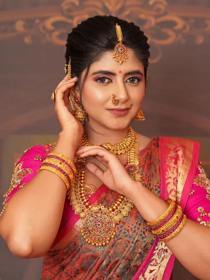 A close-up showing the intricate details of the jewelry and makeup for a grand traditional look.