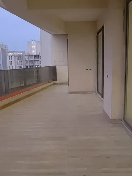 The exterior balcony of the apartment project during construction. Even outdoor spaces are considered part of the overall design, planned to connect seamlessly with the interiors.