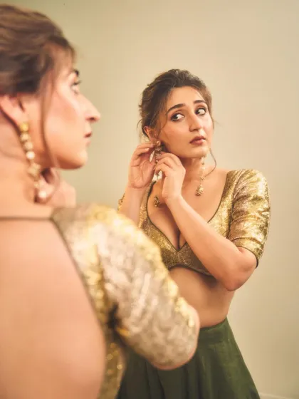 The reflection in the mirror gives this shot a lovely, intimate feel. It’s a quiet moment of preparation before a big event.