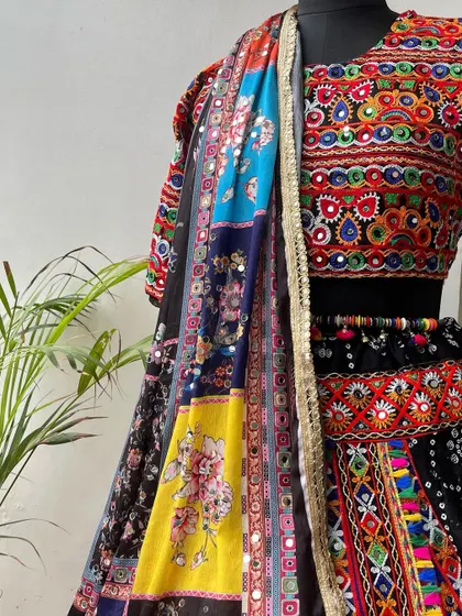 A close-up of the multi-colored dupatta, featuring beautiful floral prints and sequin details.