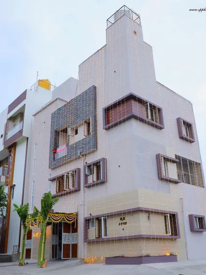 An exterior shot of a newly built house, decorated for the Griha Pravesh ceremony. We document the home itself as part of our comprehensive event coverage.