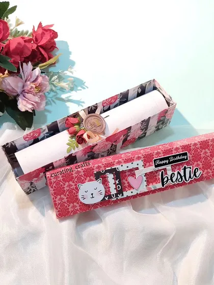 The box opened to reveal the wax-sealed scroll inside. It makes the experience of receiving the letter feel so special.